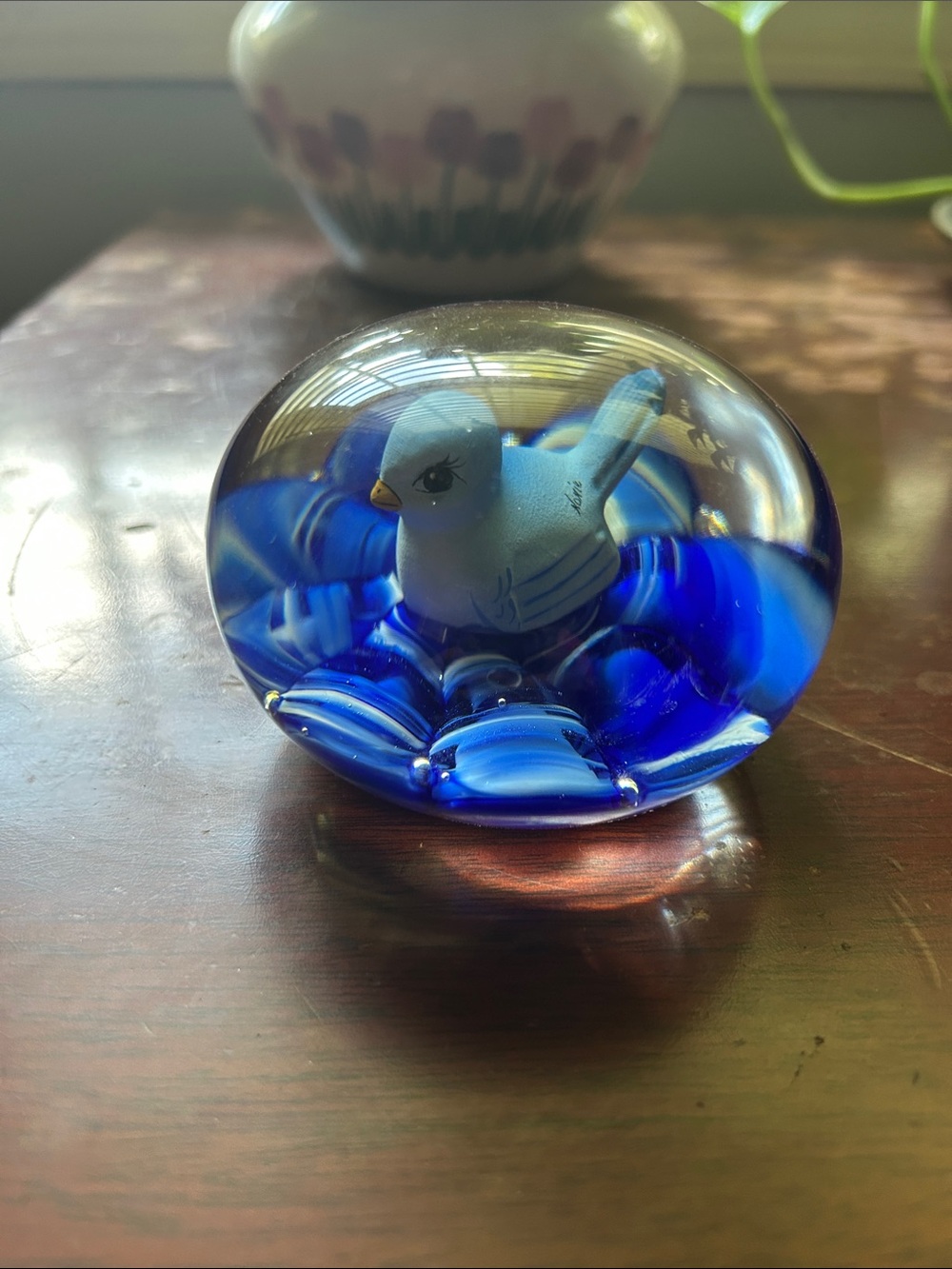 Very rare vintage Joe St. Claire handmade paperweight with blue bird on blue bed
